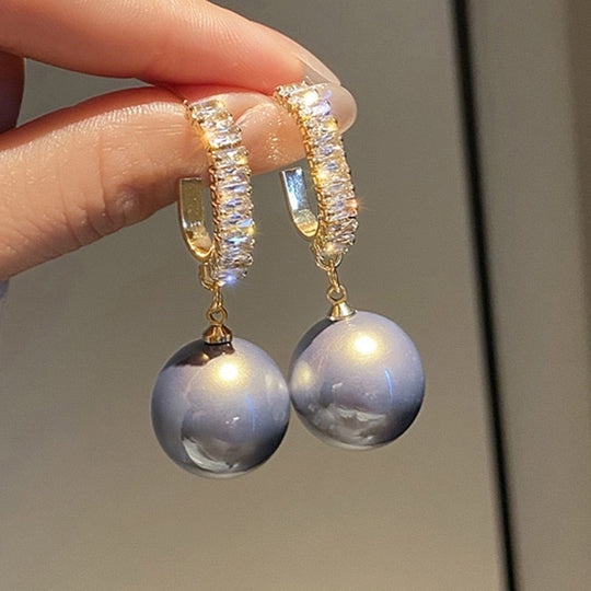 Luxuriöse Ohrringe mit schicker Perle und Zirkonia