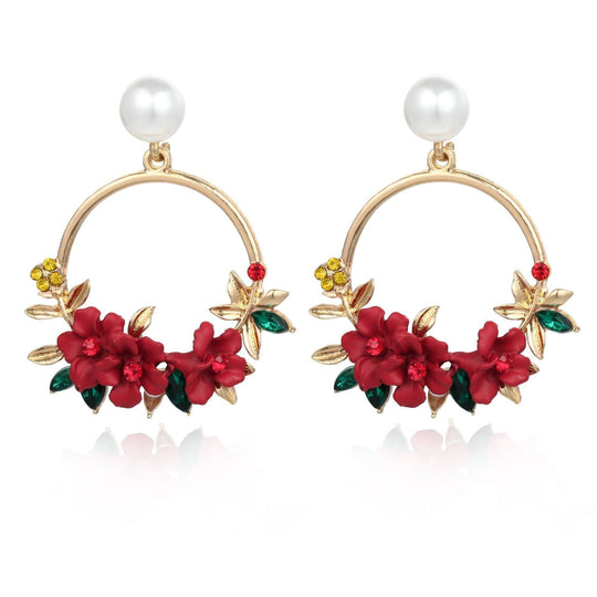 Florale Ohrringe in Loop-Form mit Perle