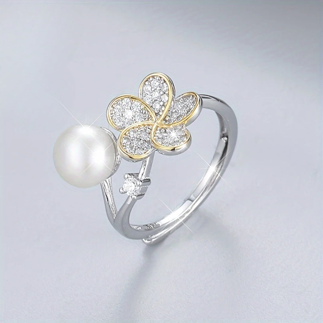 Funkelnder Silberring mit Perle und Blume