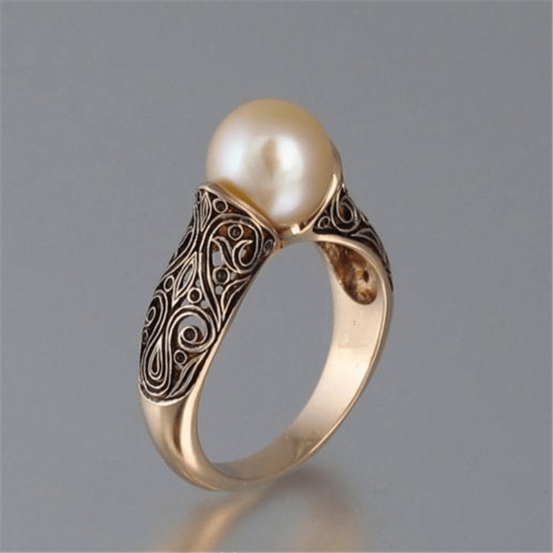 Vintage Perlenring mit goldener Fassung